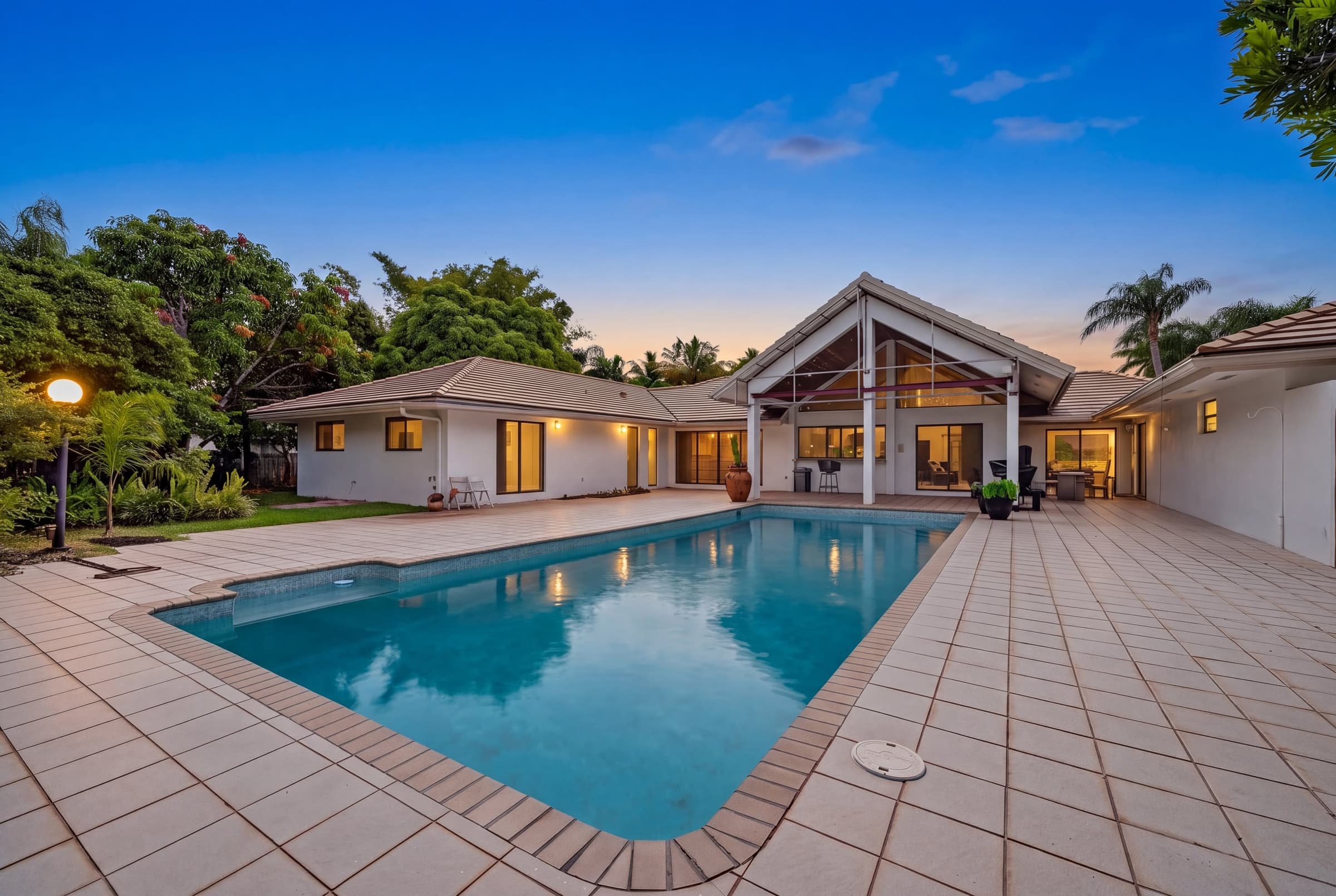 Pinecrest pool courtyard presented with a polished twilight sky